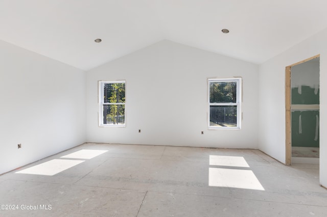 empty room with vaulted ceiling