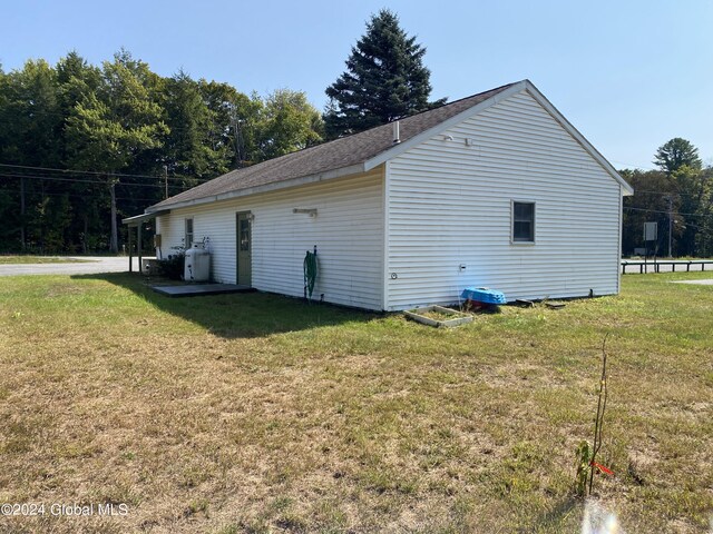 view of home's exterior with a lawn