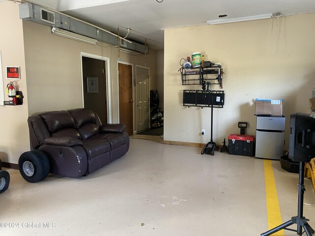 living room featuring concrete flooring