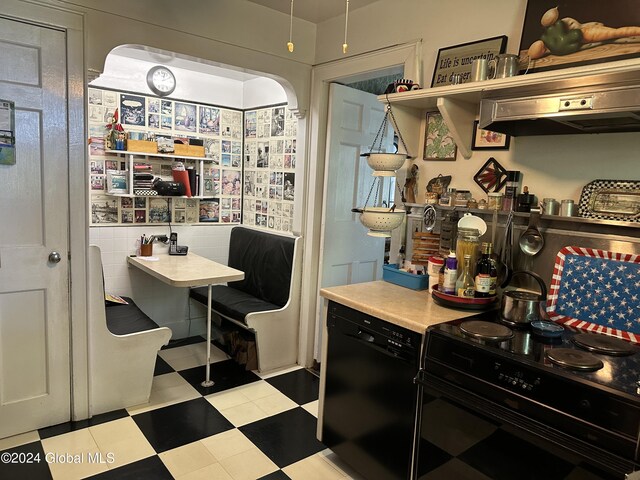 home office with tile walls