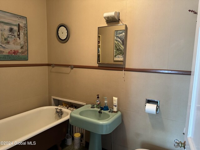 bathroom featuring a bathing tub and sink