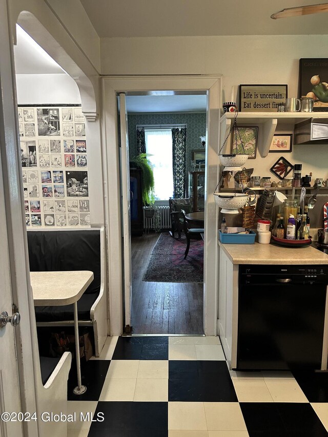 kitchen with dishwasher and light hardwood / wood-style floors