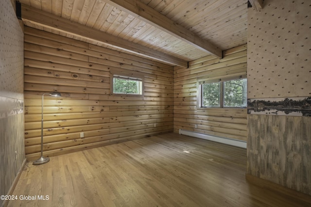 135 Sparrowhawk Lake Rd, Maryland, NY 12155 - empty room with a wealth of natural light, beam ceiling, a baseboard heating unit, and wood finished floors