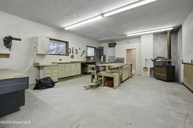135 Sparrowhawk Lake Rd, Maryland, NY 12155 - interior space featuring a workshop area and a wood stove