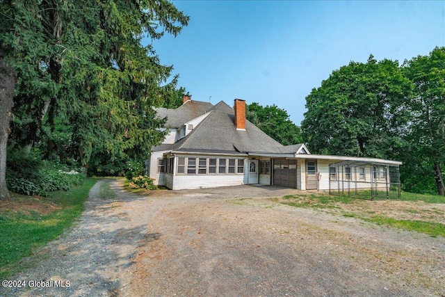 view of front of home featuring a sunroom