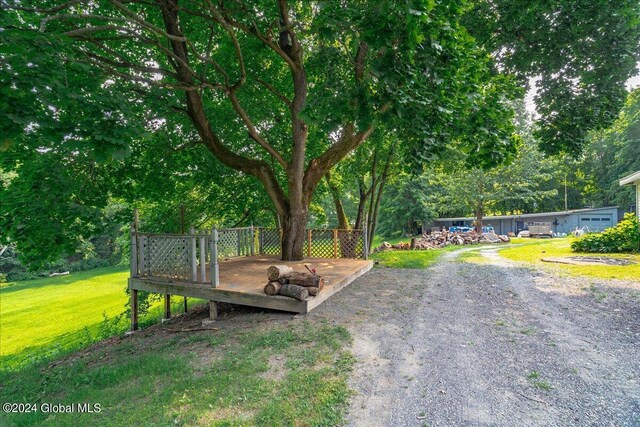 exterior space with a lawn and a wooden deck