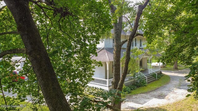 view of property exterior featuring a porch