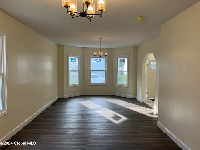 interior space featuring an inviting chandelier and dark wood-type flooring