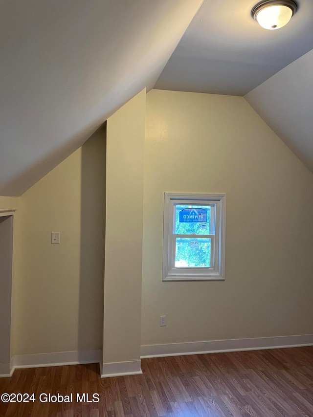 bonus room featuring lofted ceiling and hardwood / wood-style floors