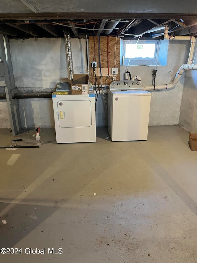 basement with washer and clothes dryer