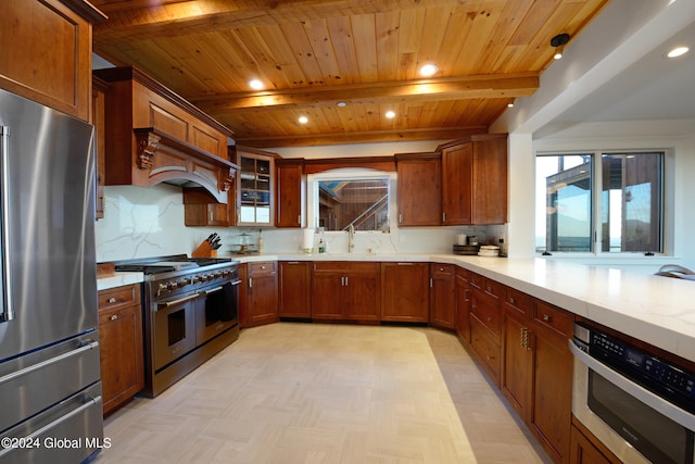 kitchen with beamed ceiling, appliances with stainless steel finishes, sink, and wooden ceiling