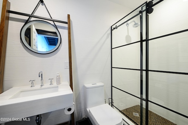 bathroom featuring sink, toilet, and a shower