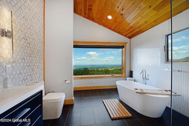 bathroom featuring lofted ceiling, toilet, wooden ceiling, a bathing tub, and vanity