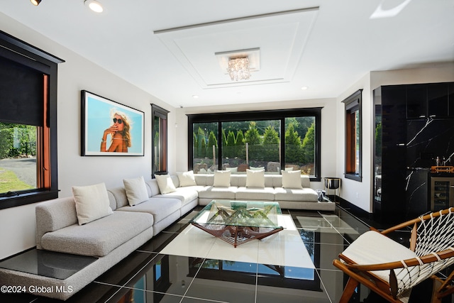 tiled living room featuring a healthy amount of sunlight