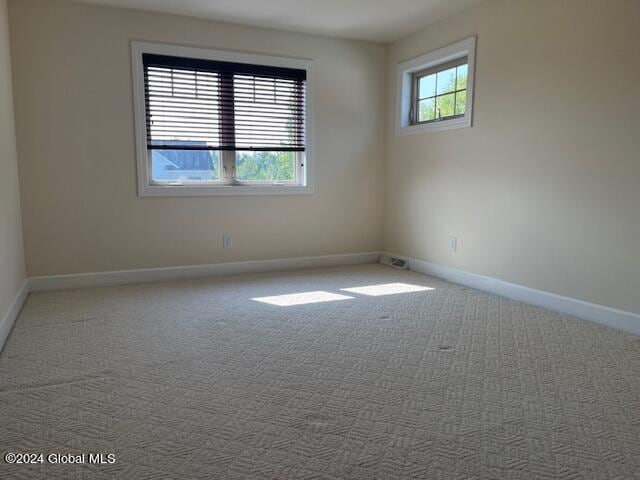 empty room with carpet flooring