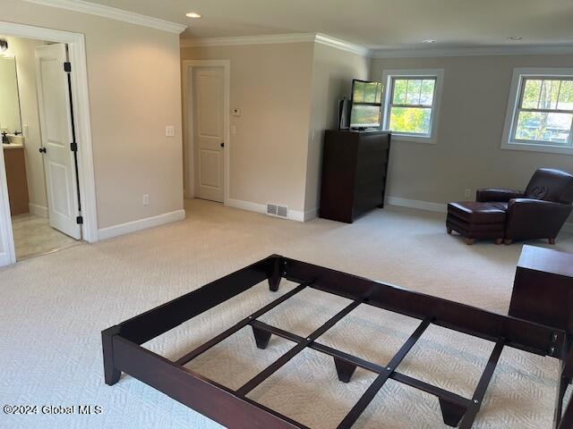 living room featuring crown molding and light colored carpet