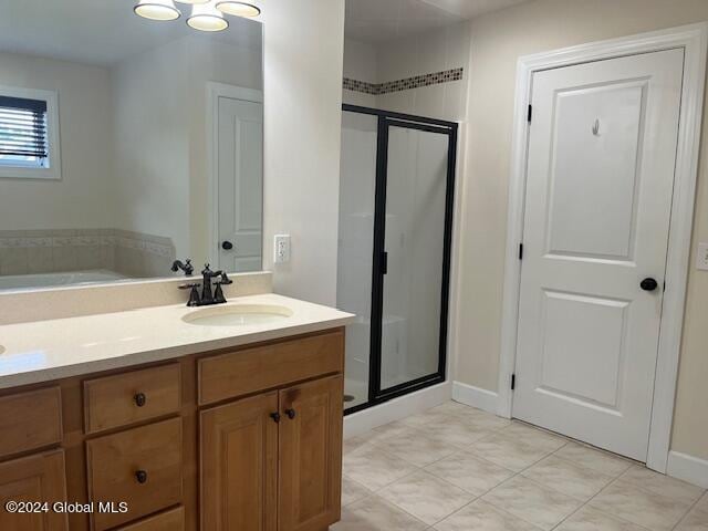 bathroom featuring vanity and walk in shower