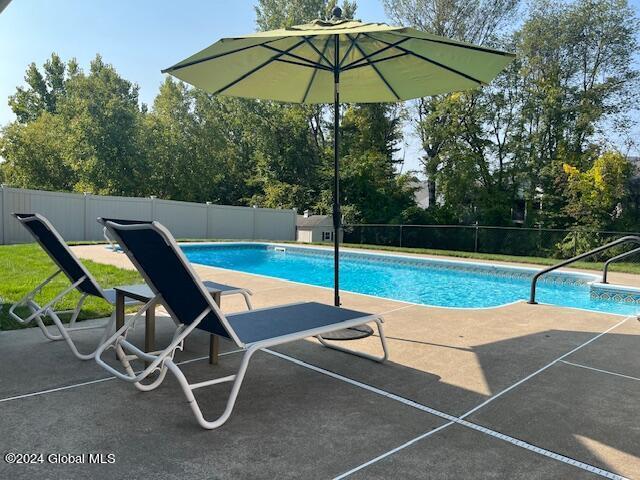 view of pool featuring a patio area