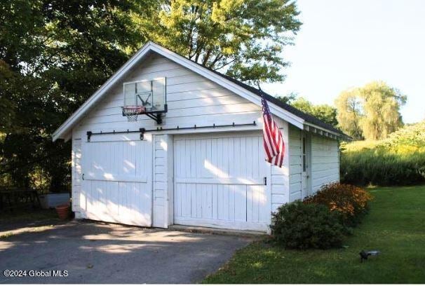 garage with a lawn