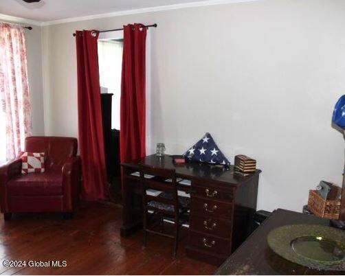 office space with dark hardwood / wood-style floors and crown molding