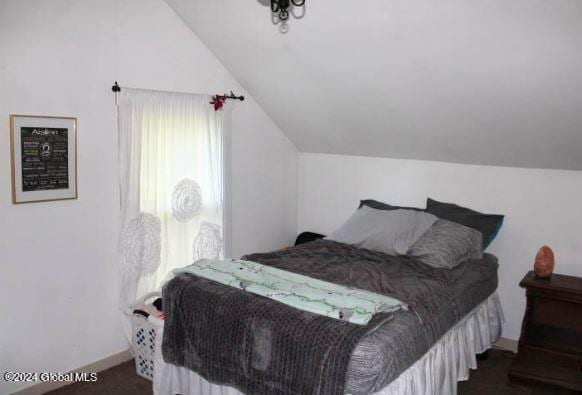 bedroom featuring vaulted ceiling