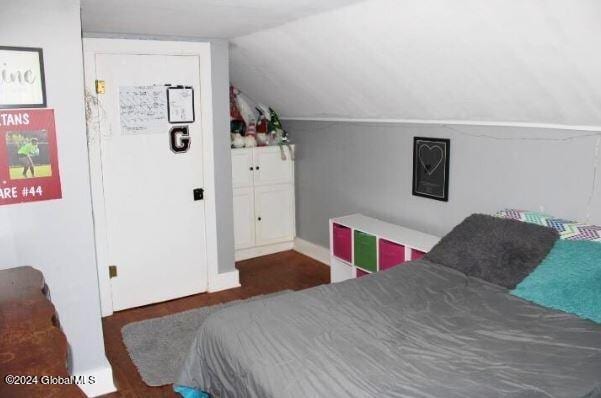 bedroom featuring lofted ceiling