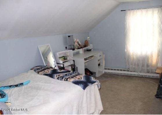 carpeted bedroom with vaulted ceiling and baseboard heating