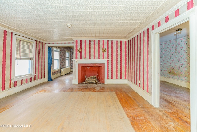 unfurnished living room with wood-type flooring