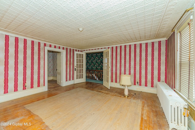 interior space featuring radiator and wood-type flooring