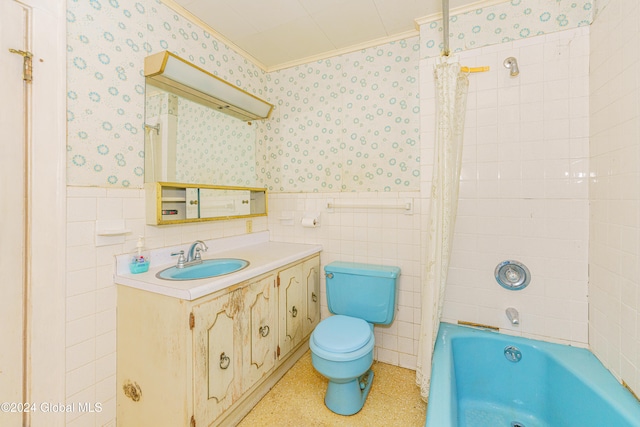 full bathroom with toilet, vanity, tile walls, and shower / tub combo