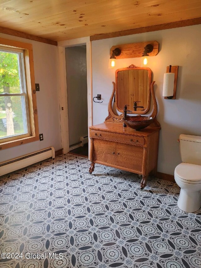 bathroom with toilet, wood ceiling, vanity, and a baseboard radiator