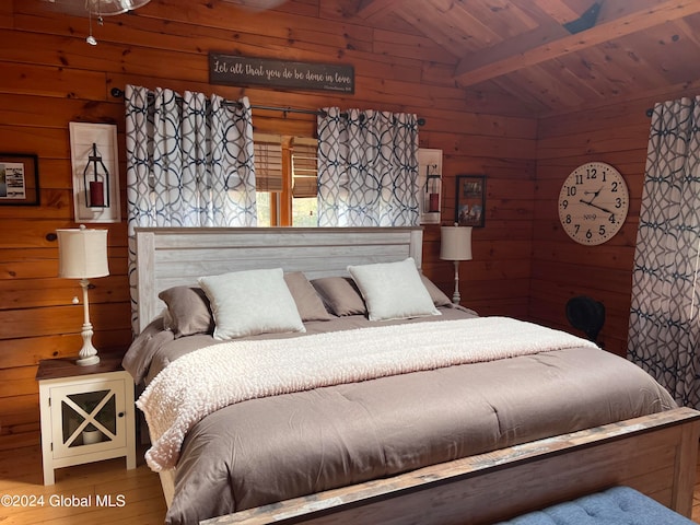 bedroom with hardwood / wood-style flooring, wooden walls, lofted ceiling with beams, and wood ceiling