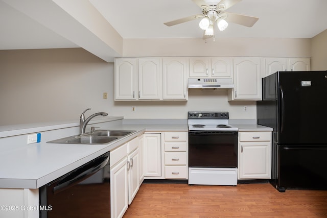 kitchen with white cabinets, sink, and black appliances