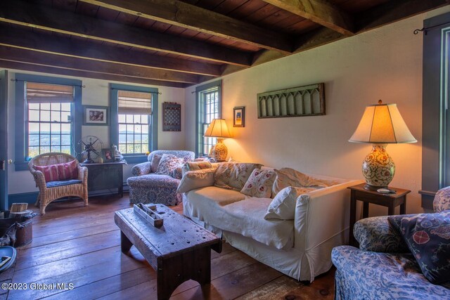 living room featuring wood ceiling, beamed ceiling, and hardwood / wood-style flooring