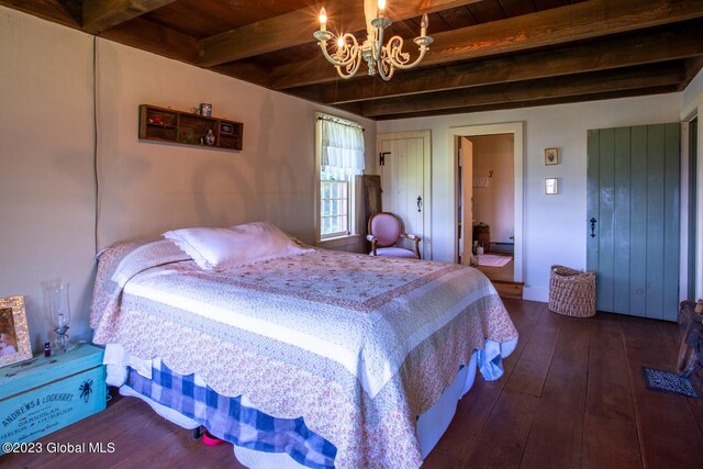 bedroom with wooden ceiling, dark hardwood / wood-style flooring, beamed ceiling, and a notable chandelier