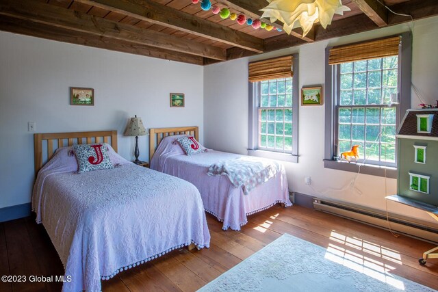 bedroom with wood ceiling, hardwood / wood-style floors, beam ceiling, and multiple windows