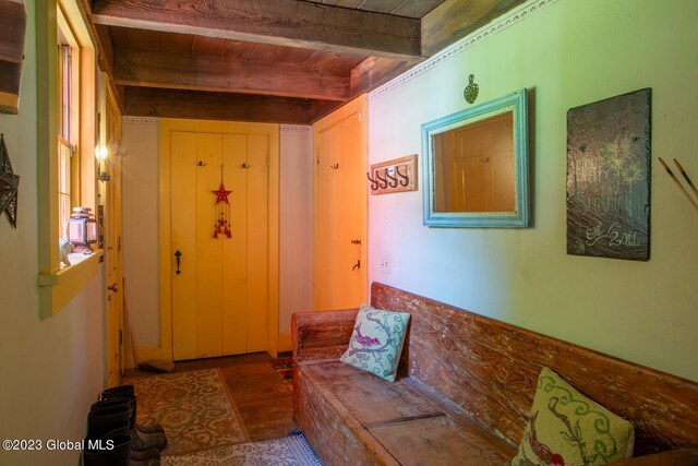 living room featuring wood ceiling and beamed ceiling