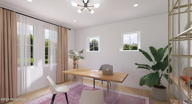 office featuring a notable chandelier and light hardwood / wood-style floors