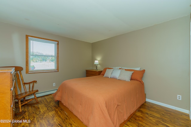 bedroom with dark wood-type flooring