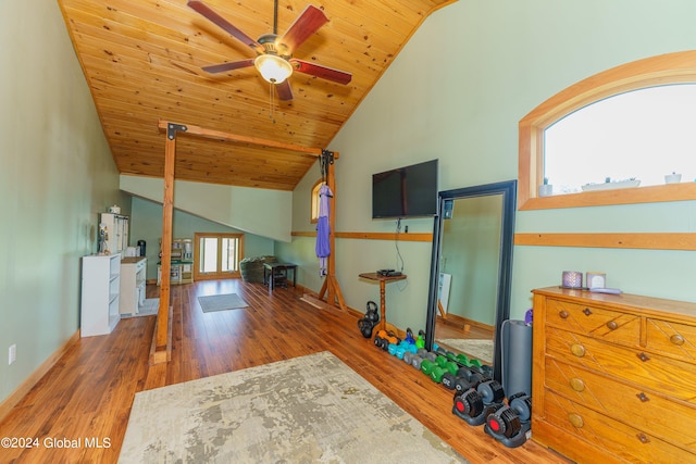 interior space featuring wood-type flooring, wood ceiling, high vaulted ceiling, and ceiling fan