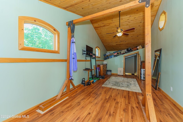 living room featuring ceiling fan, hardwood / wood-style flooring, lofted ceiling, and wood ceiling