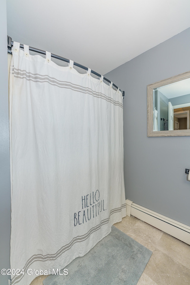 bathroom with a baseboard heating unit