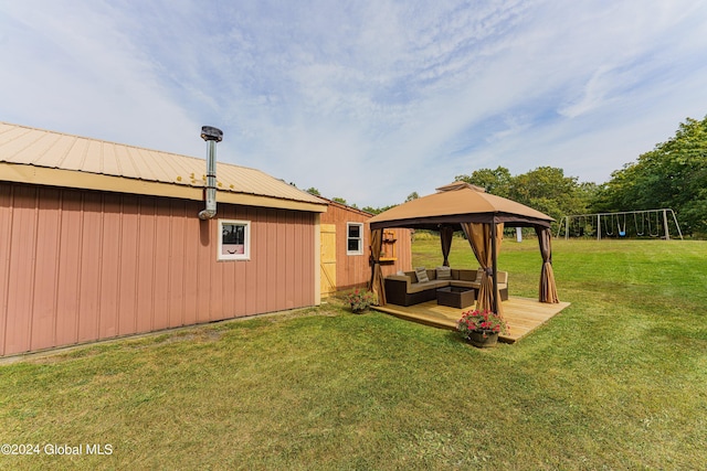 view of yard featuring outdoor lounge area and a gazebo