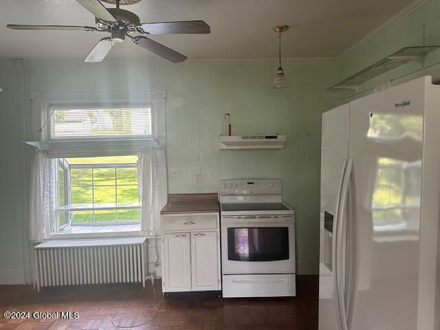 kitchen with hanging light fixtures, white appliances, radiator, ceiling fan, and extractor fan