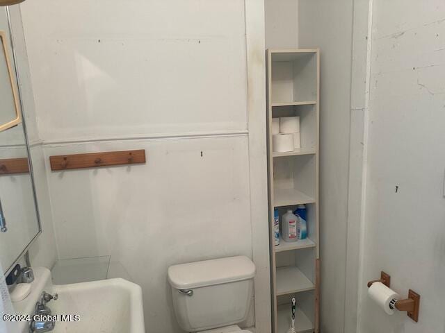 bathroom featuring sink and toilet