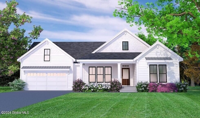 view of front of property with a front yard, a garage, and covered porch