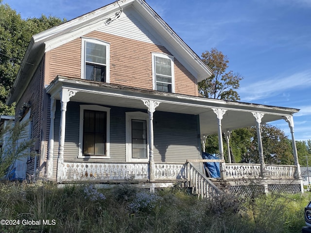 8 First Ln, Port Henry, NY 12974 - view of front of house featuring covered porch