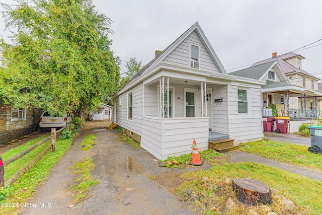 bungalow-style house featuring covered porch