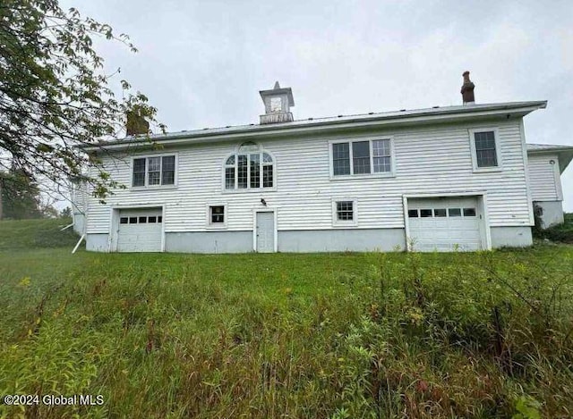 L42.2 Gabryszewski Rd, Saint Johnsville, NY 13452 - back of property with an attached garage and a chimney