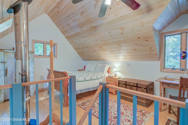 bedroom with multiple windows, wood ceiling, hardwood / wood-style floors, and ceiling fan